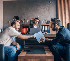 Contract Lawyer looking at contract breach case with client